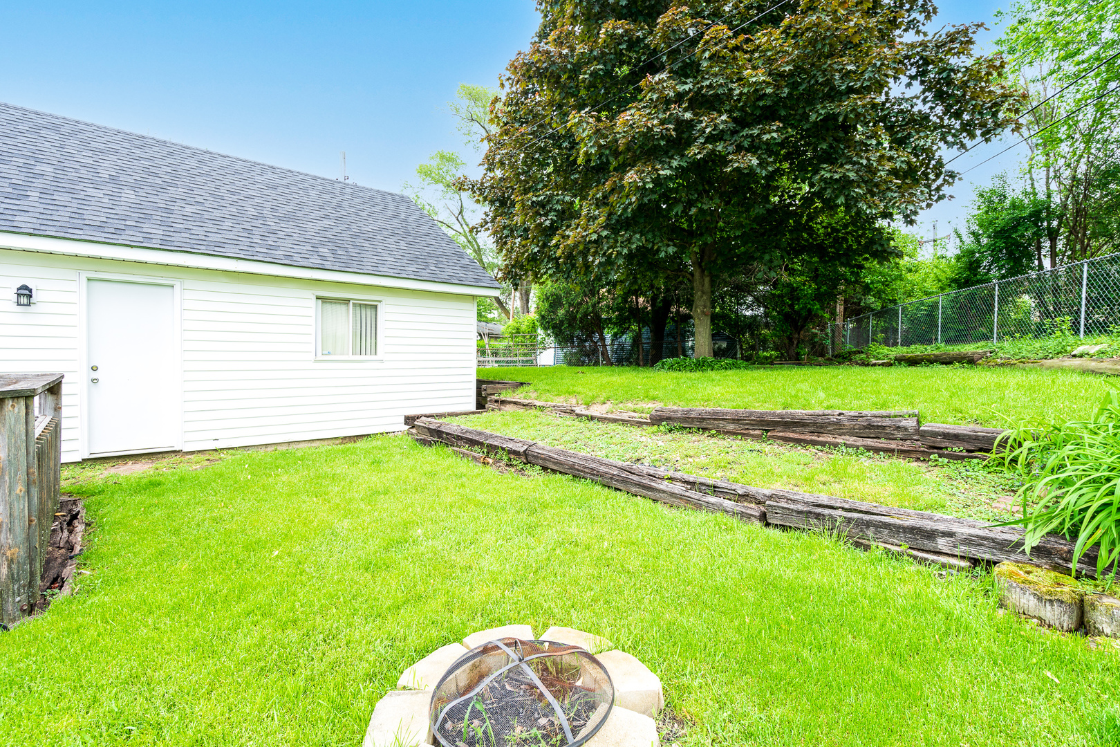 204 MacIntyre Street Lockport, IL 60441 - Photo 27 of 27 a view of a backyard with a garden