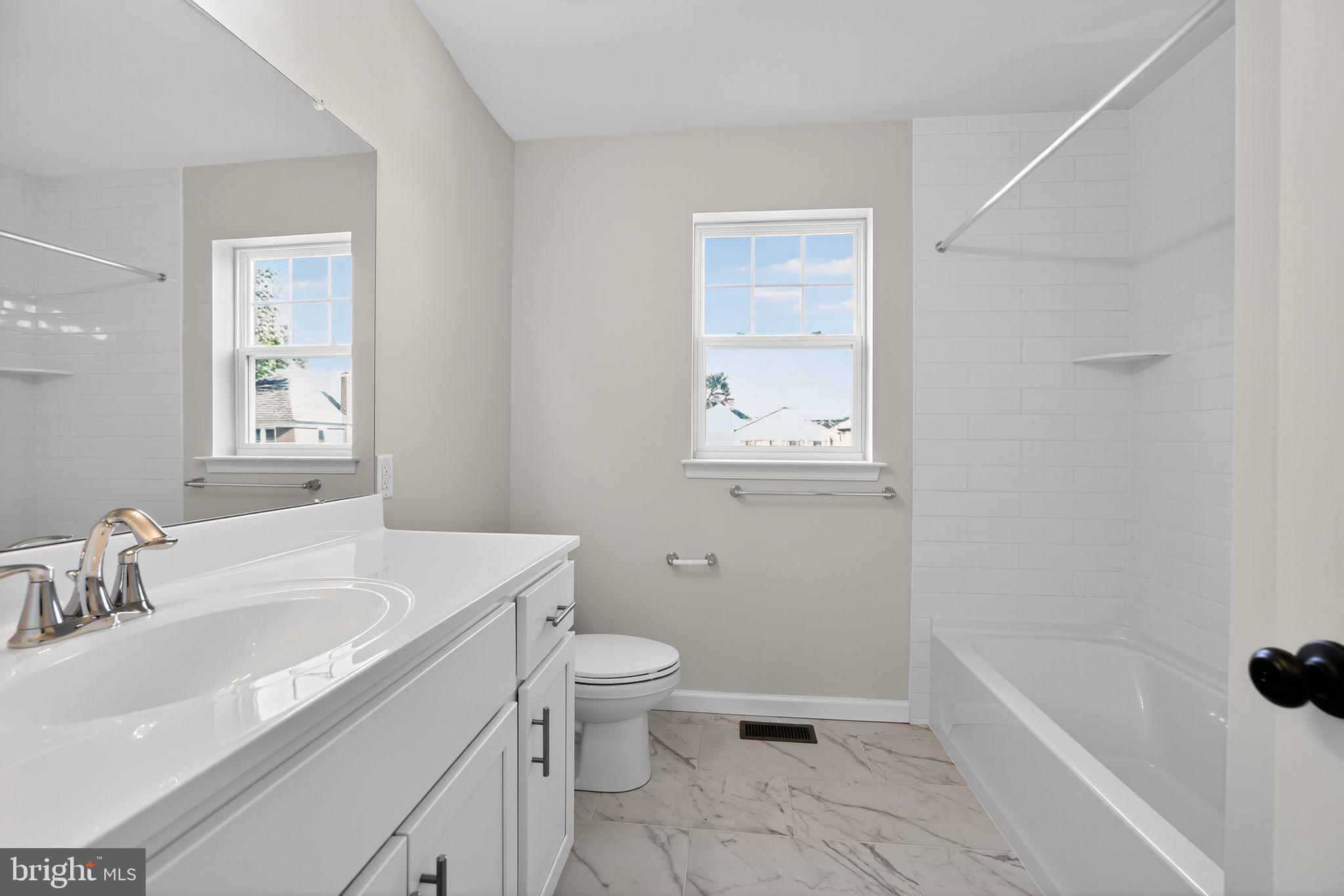 102 High Street Dublin, PA 18917 - Photo 21 of 24 a bathroom with a sink a toilet and bathtub