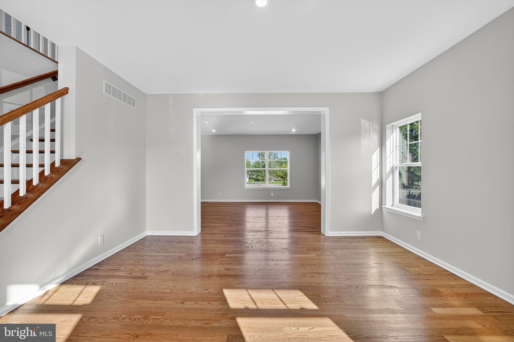 102 High Street Dublin, PA 18917 - Photo 5 of 24 an empty room with wooden floor and windows