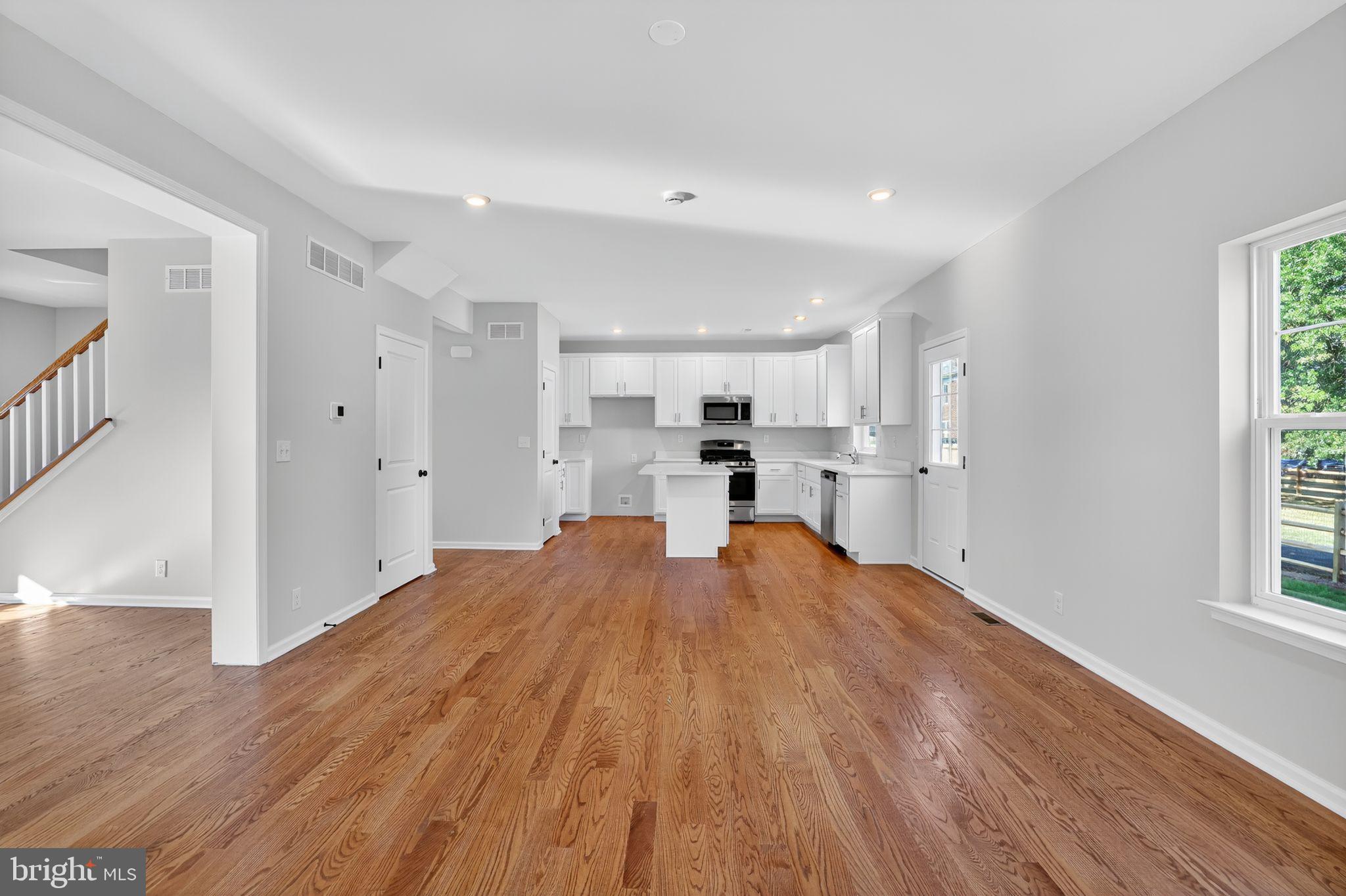 102 High Street Dublin, PA 18917 - Photo 7 of 24 a large space with kitchen view and wooden floor