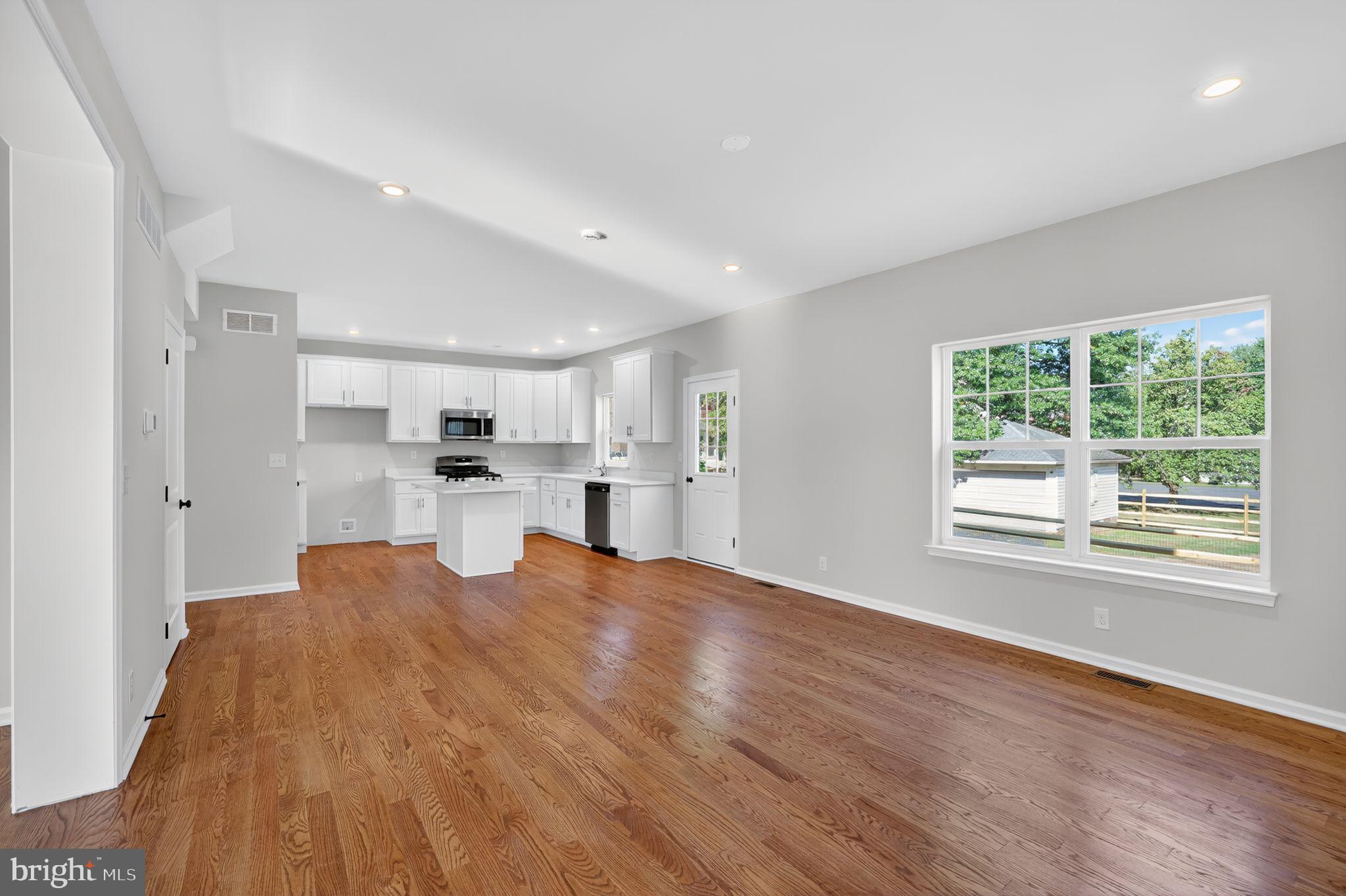 102 High Street Dublin, PA 18917 - Photo 9 of 24 a view of a kitchen and window with wooden floor