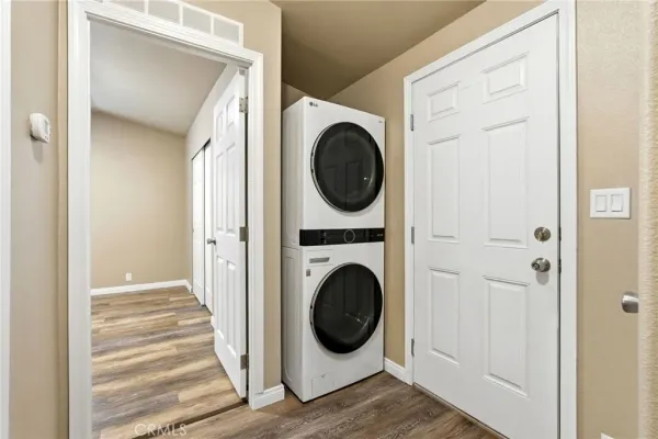 a view of a hallway with washer and dryer