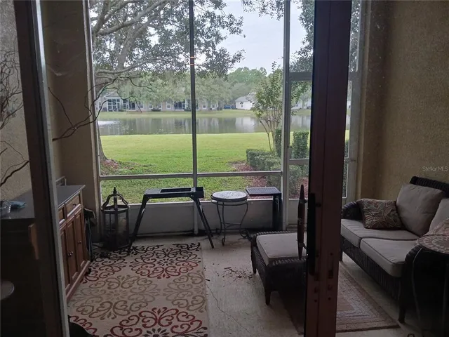 a balcony with furniture and outdoor view