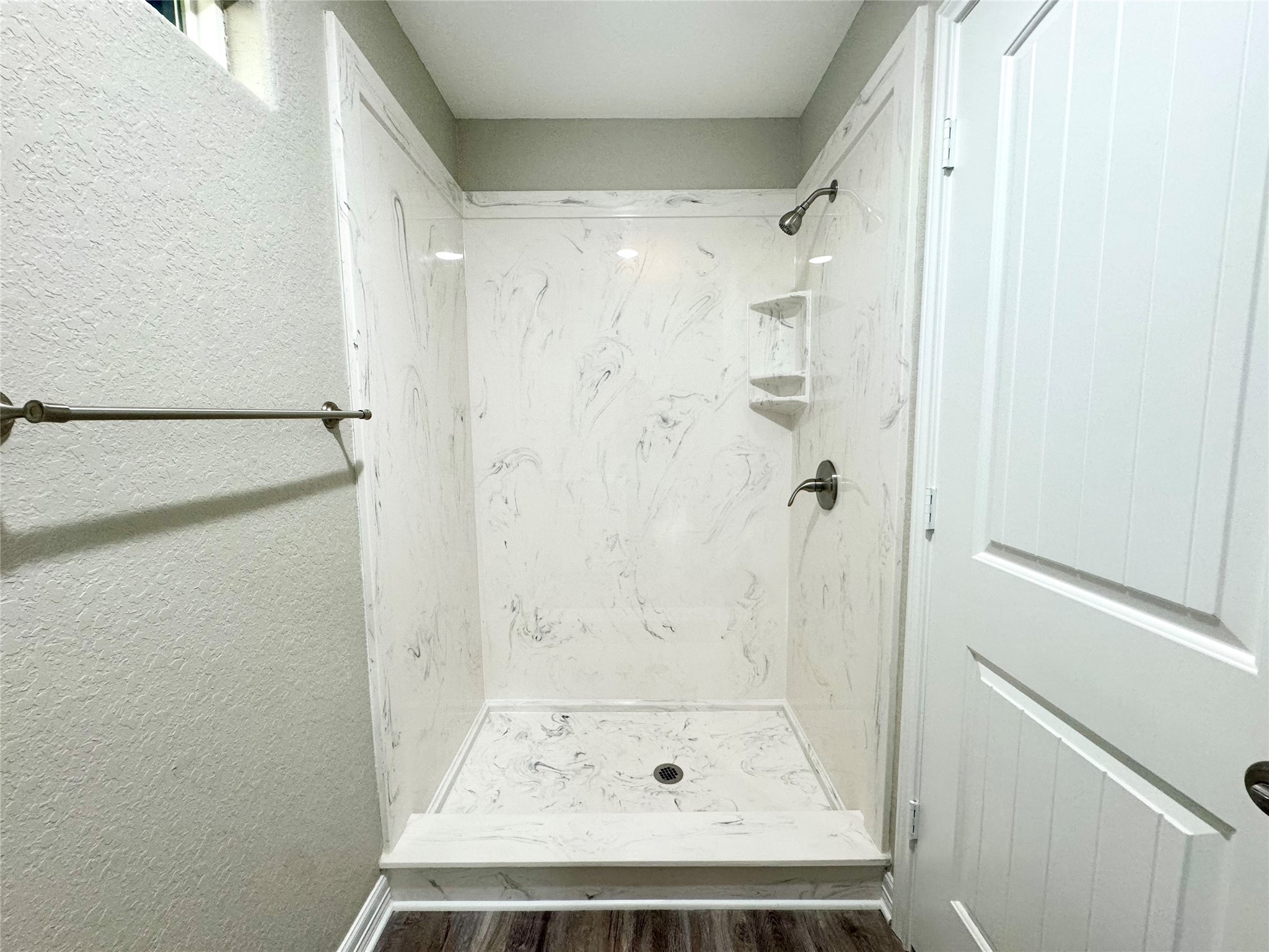 511 Caisson Street Surfside Beach, TX 77541 - Photo 31 of 33 a bathroom with a glass shower door
