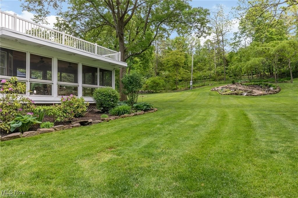 644 Riverside Drive Painesville, OH 44077 - Photo 28 of 48 View of yard featuring a sunroom and a balcony