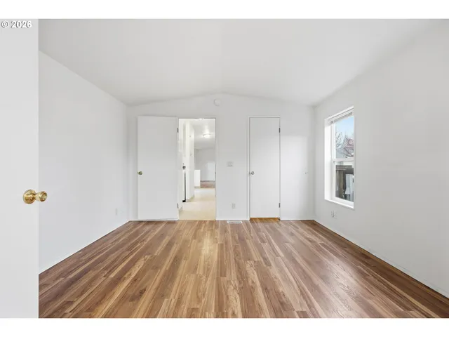 a bathroom with a bathtub sink and mirror
