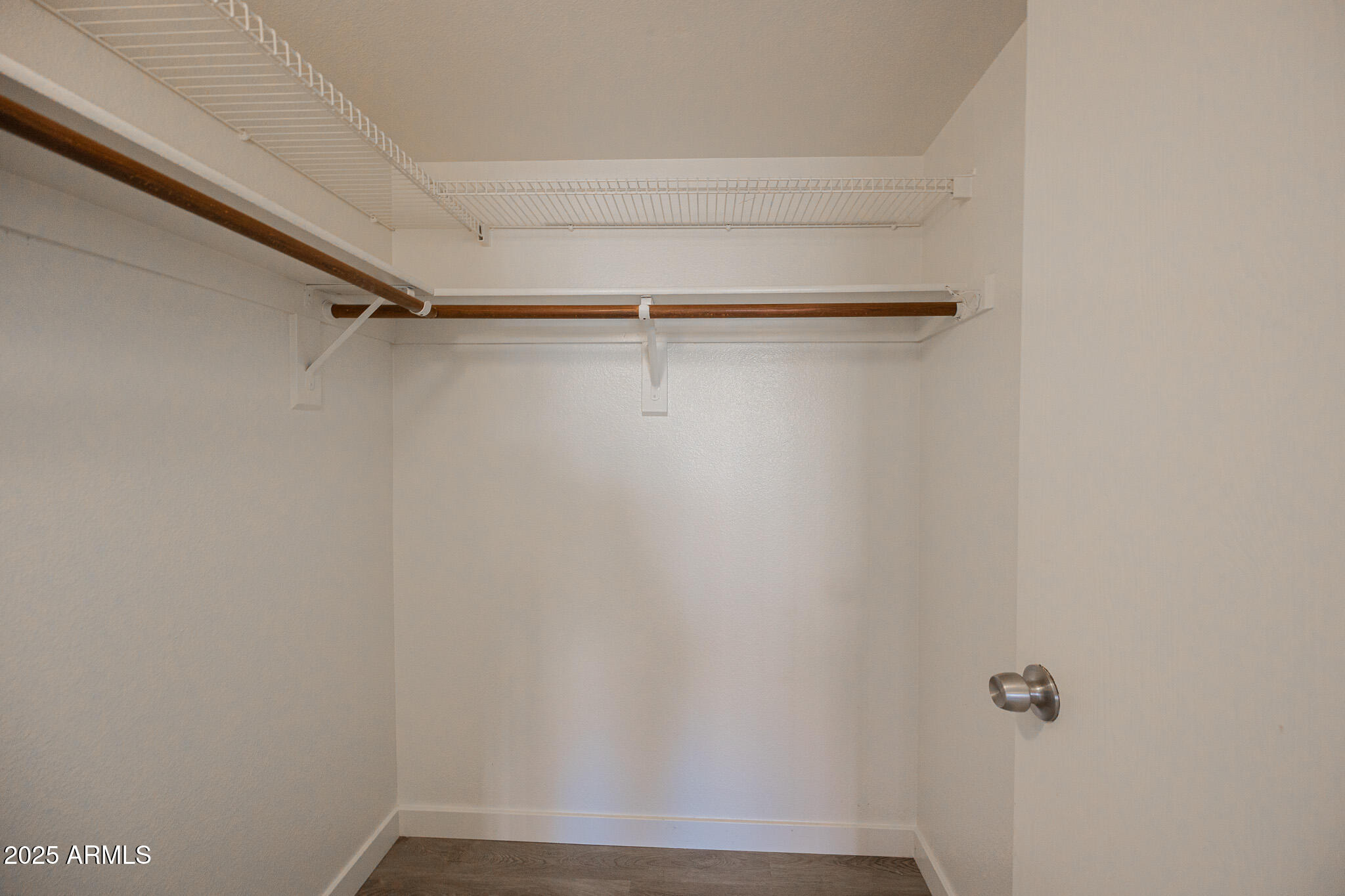 3131 West Cochise Drive, Unit 129 Phoenix, AZ 85051 - Photo 14 of 17 a view of a room with shelf on the wall