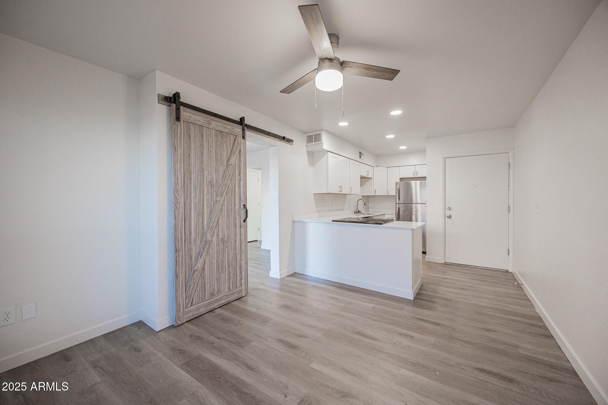 3131 West Cochise Drive, Unit 129 Phoenix, AZ 85051 - Photo 5 of 17 a view of kitchen with wooden floor