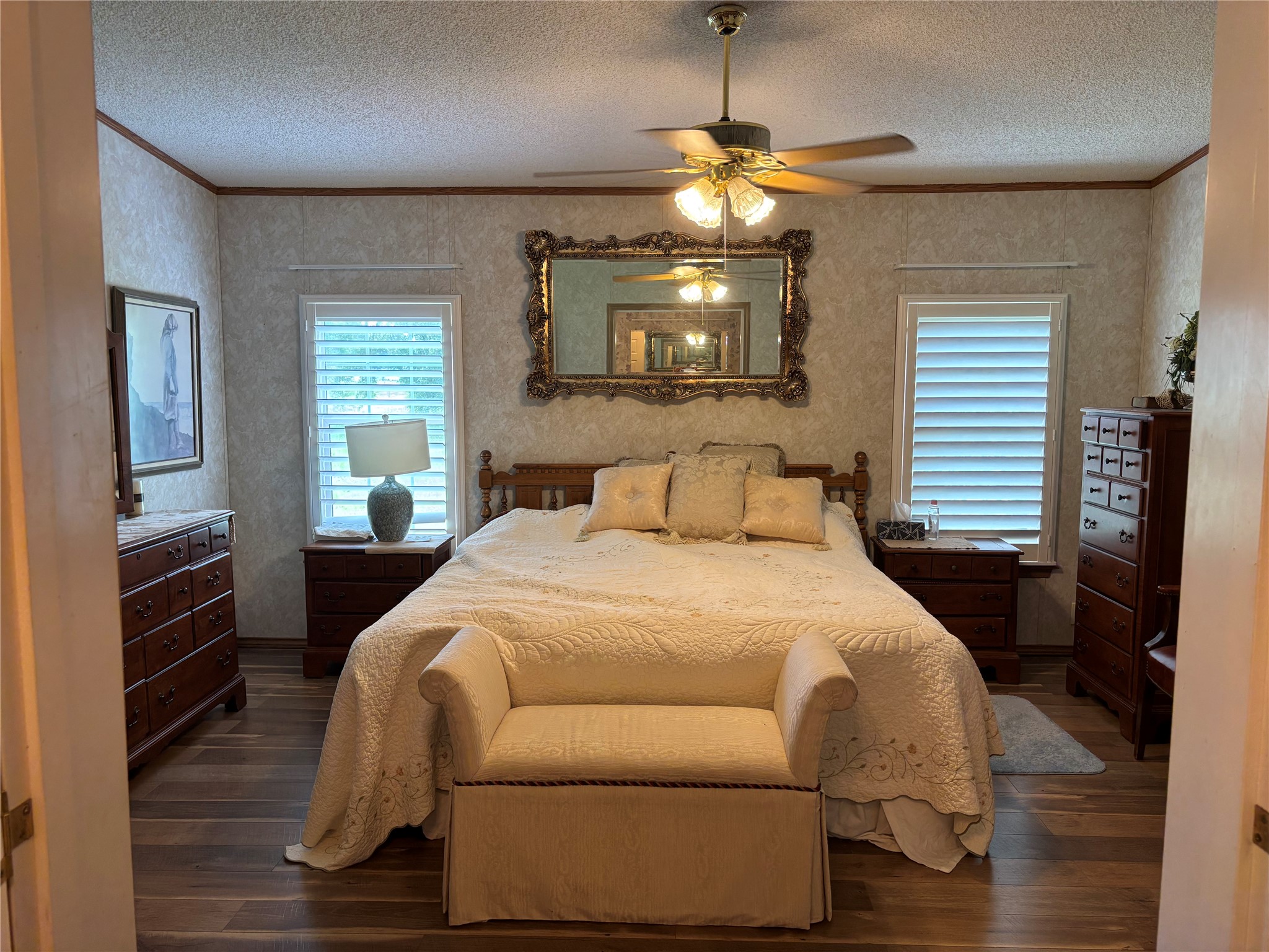 35599 State Highway South Buna, TX 77612 - Photo 26 of 40 a bedroom with a bed and a chandelier