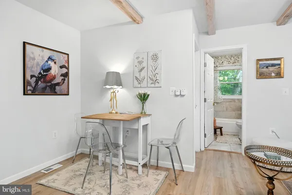 a view of a dining room with furniture window and wooden floor