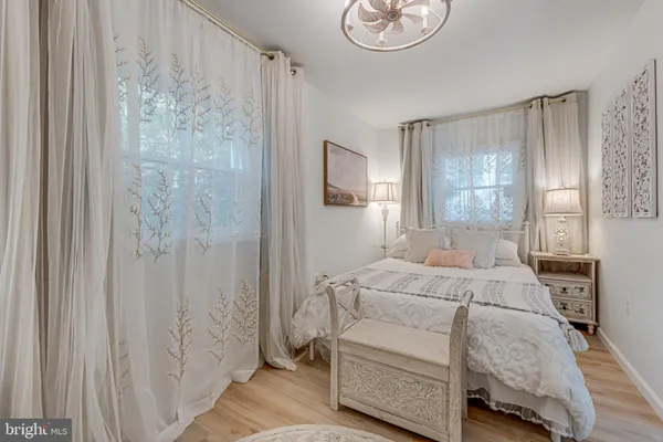 a room with a bed and a chandelier