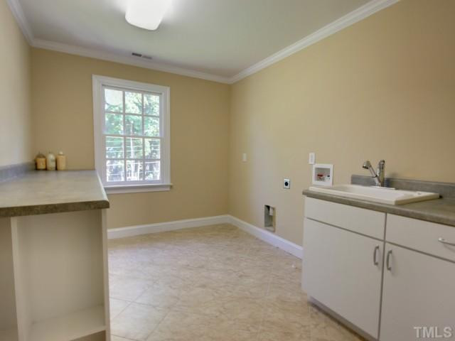 206 Avon Drive Raleigh, NC 27608 - Photo 10 of 12 Also conveniently located upstairs is the Tiled Utility Room with Utility Sink, Lots of Counter Space, and Storage. Other