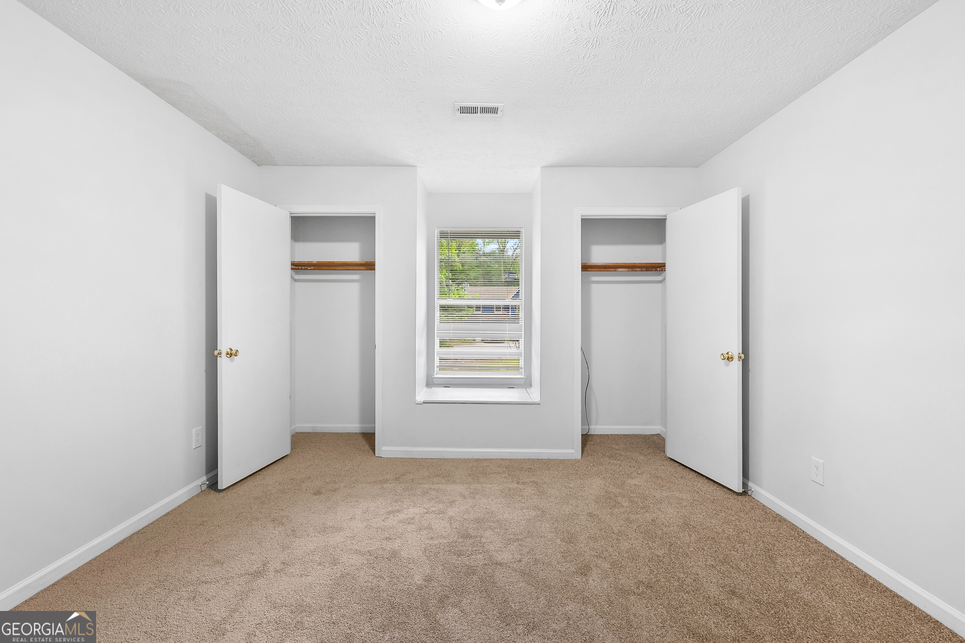 1328 Foxvale Drive Hampton, GA 30228 - Photo 18 of 27 a view of an empty room with a window