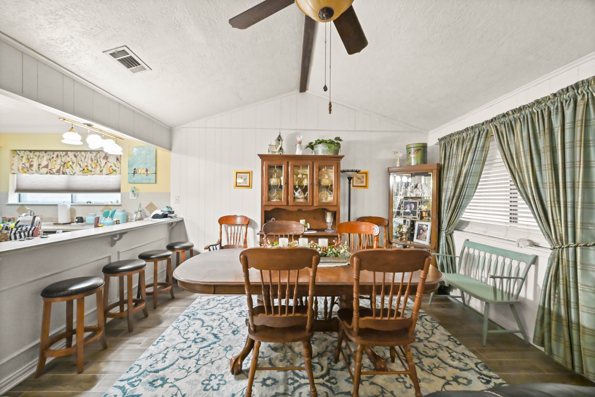 20135 Fox Grove Lane Humble, TX 77338 - Photo 12 of 34 a dining room with furniture a rug and wooden floor