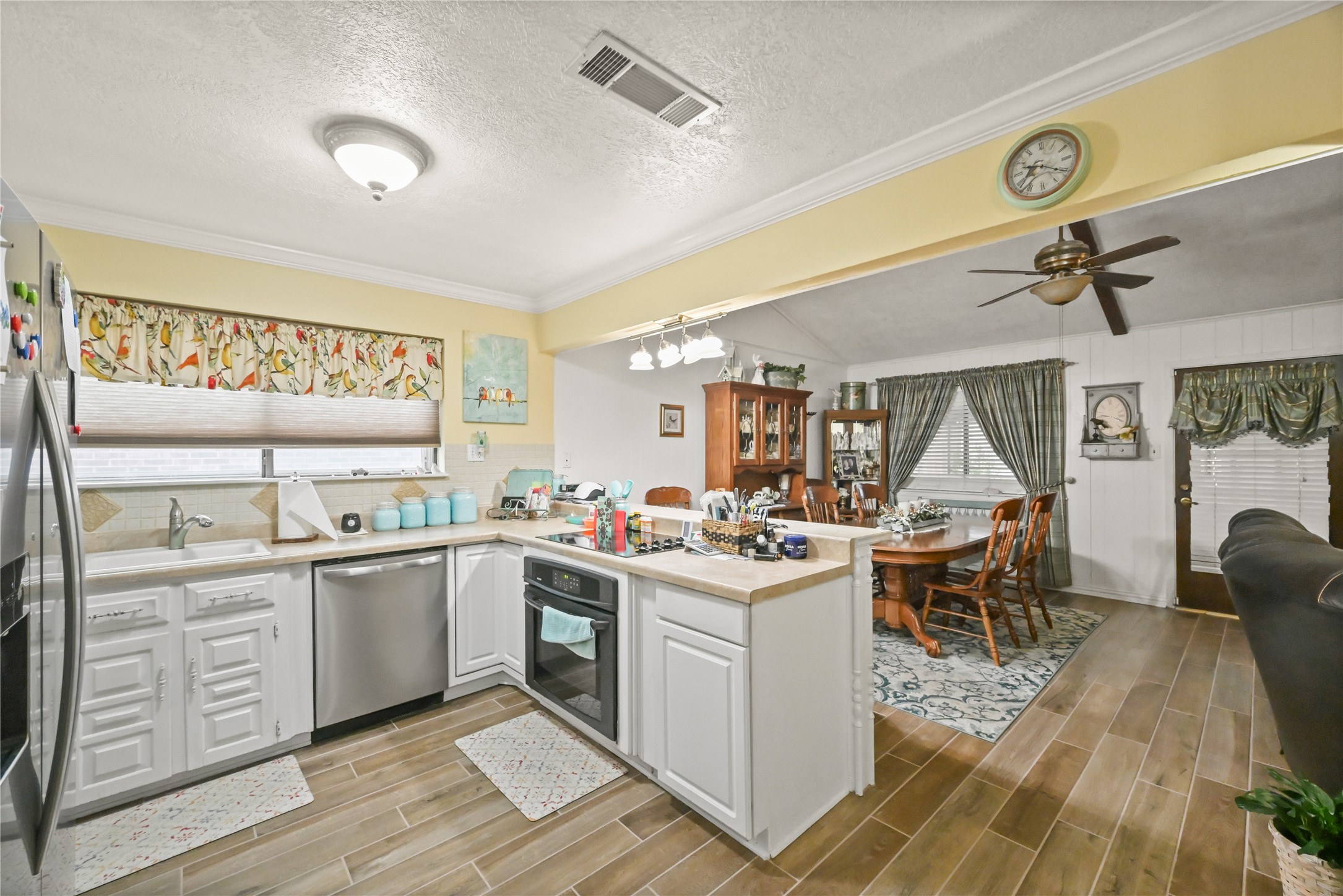 20135 Fox Grove Lane Humble, TX 77338 - Photo 15 of 34 a view of a kitchen counter space with wooden floor and stainless steel appliances