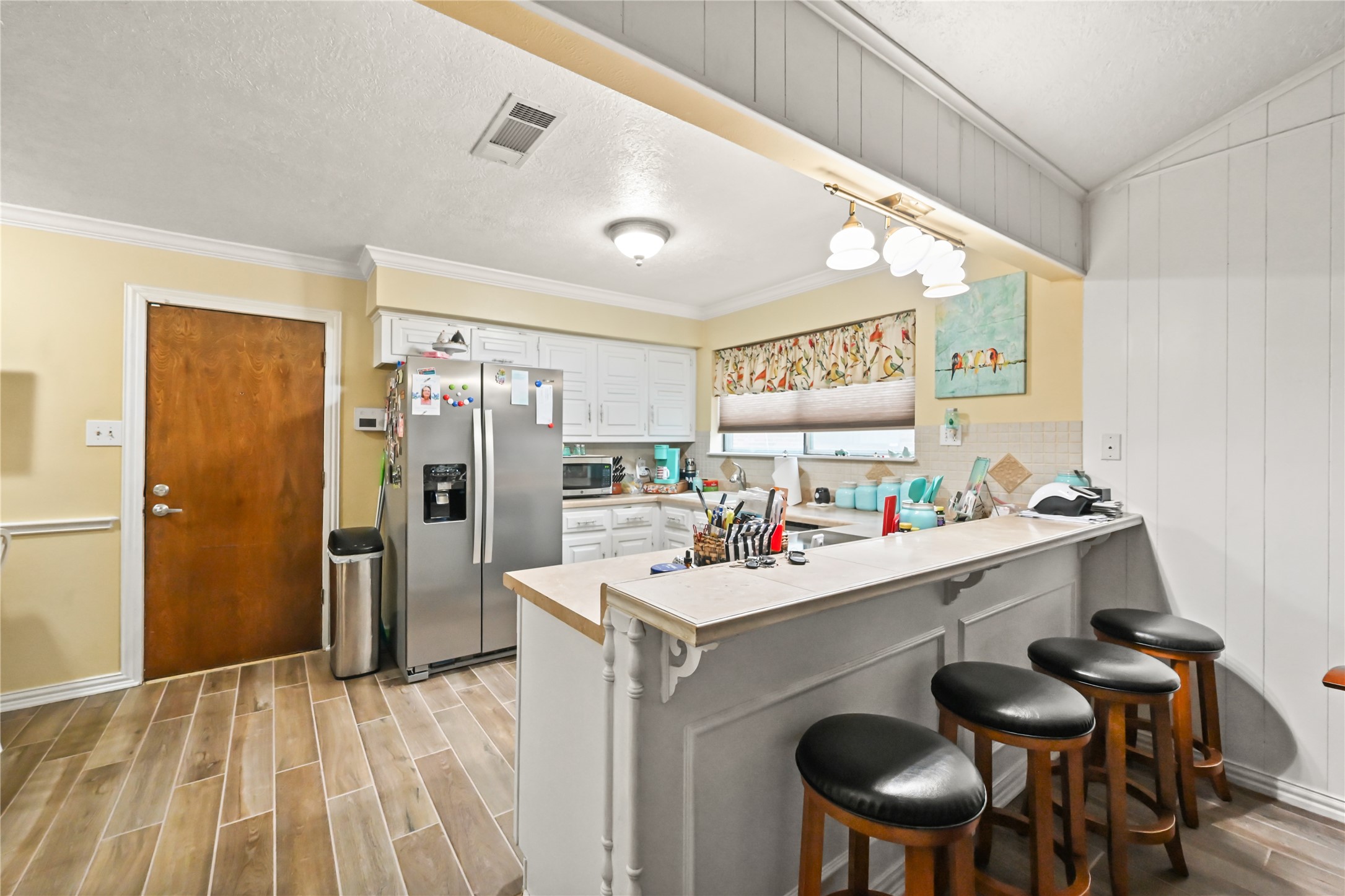 20135 Fox Grove Lane Humble, TX 77338 - Photo 16 of 34 a kitchen with a sink cabinets and refrigerator