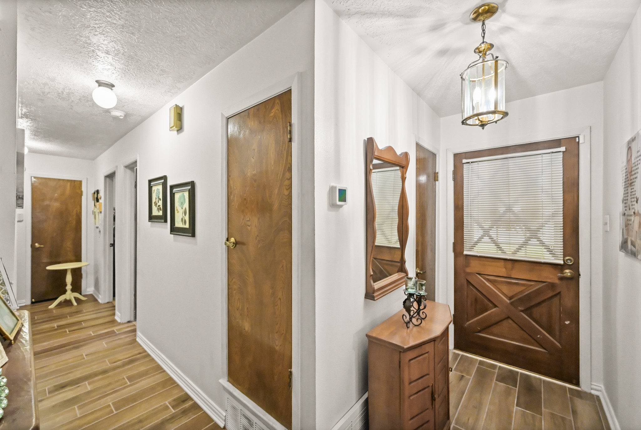 20135 Fox Grove Lane Humble, TX 77338 - Photo 18 of 34 a view of a hallway with wooden floor and windows