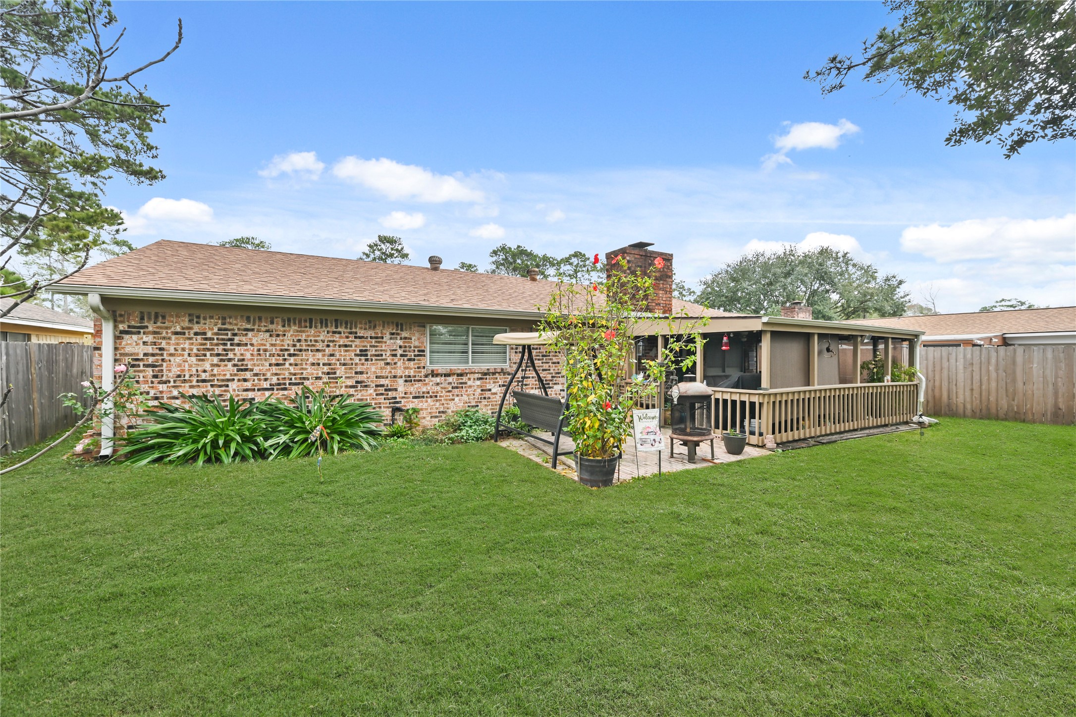 20135 Fox Grove Lane Humble, TX 77338 - Photo 30 of 34 a view of a house with backyard porch and garden
