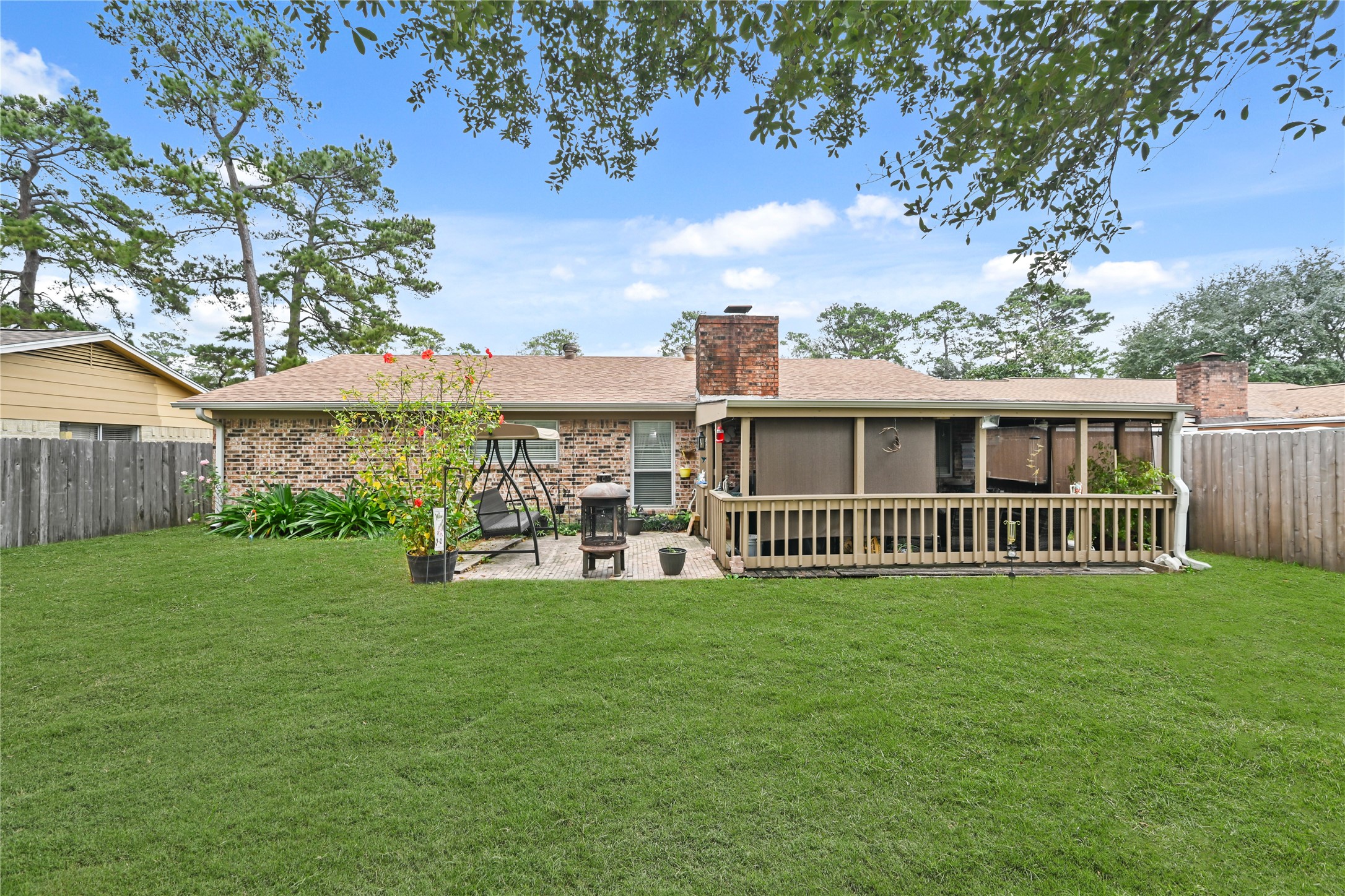 20135 Fox Grove Lane Humble, TX 77338 - Photo 31 of 34 a view of a house with a yard and a porch
