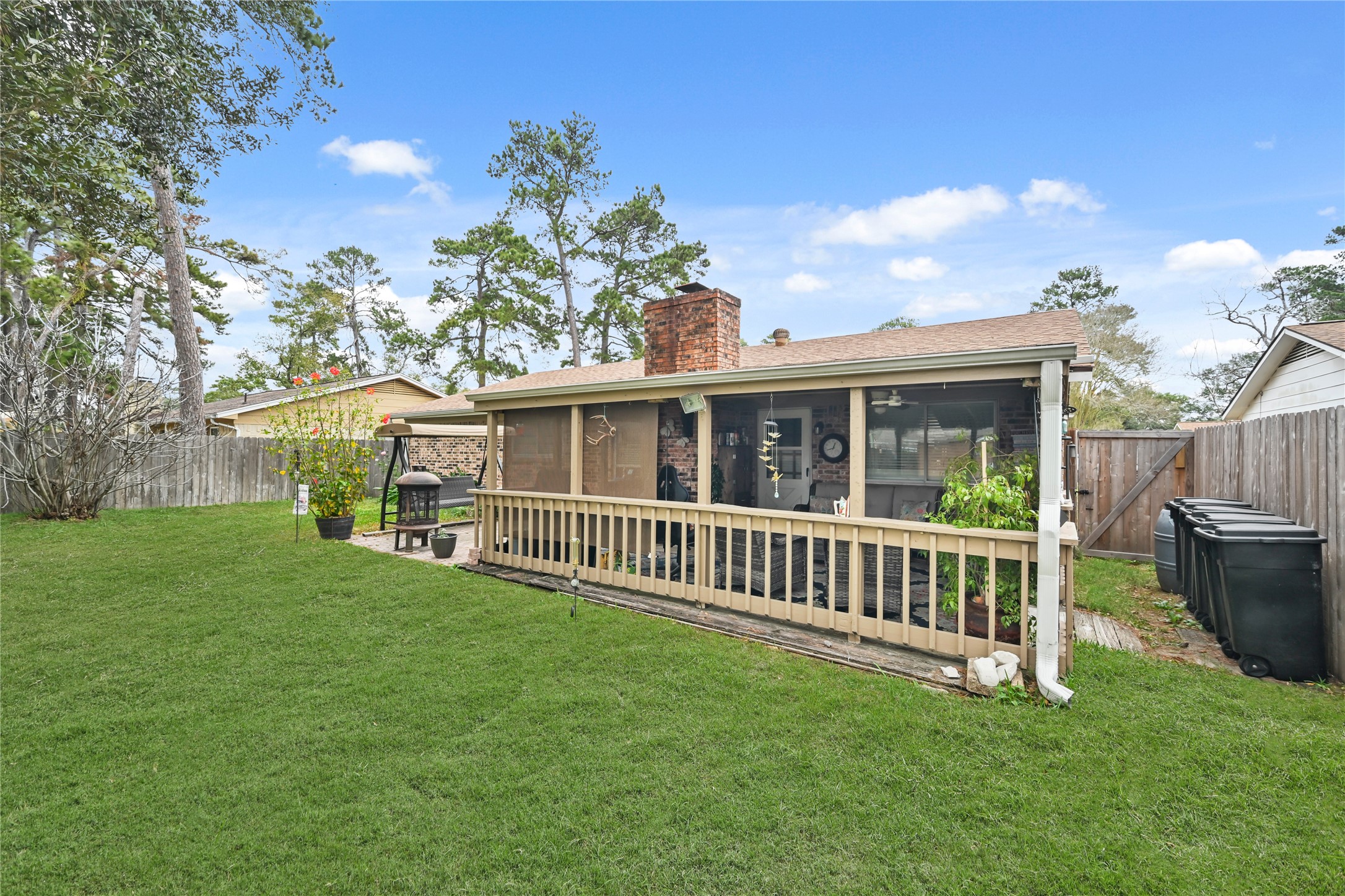 20135 Fox Grove Lane Humble, TX 77338 - Photo 32 of 34 a view of a house with backyard and porch