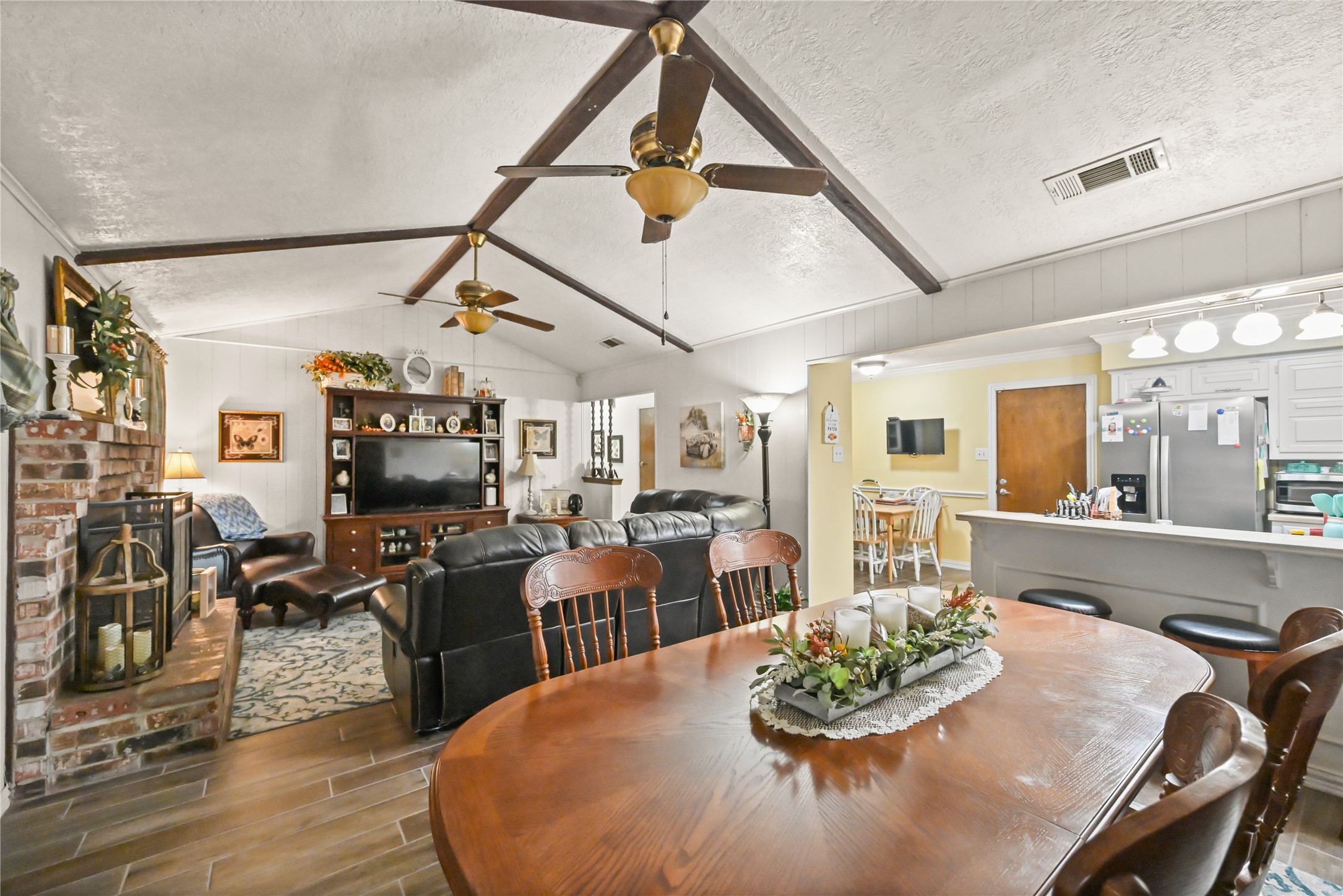 20135 Fox Grove Lane Humble, TX 77338 - Photo 10 of 34 a dining room with wooden floor furniture and a kitchen view