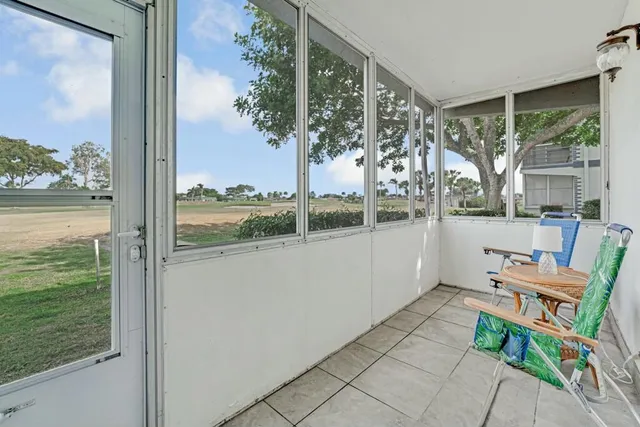 a porch area with view of outdoor space