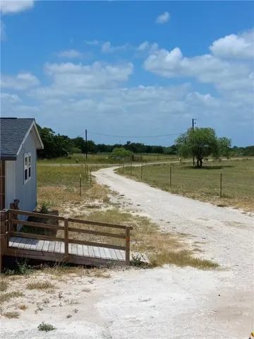 a kitchen with a refrigerator and a stove