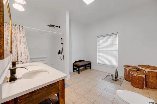 a bathroom with a sink and a window