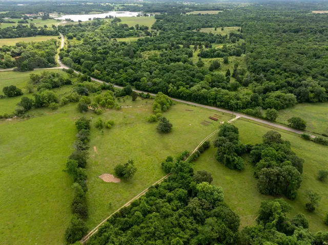 a view of a lake with a yard