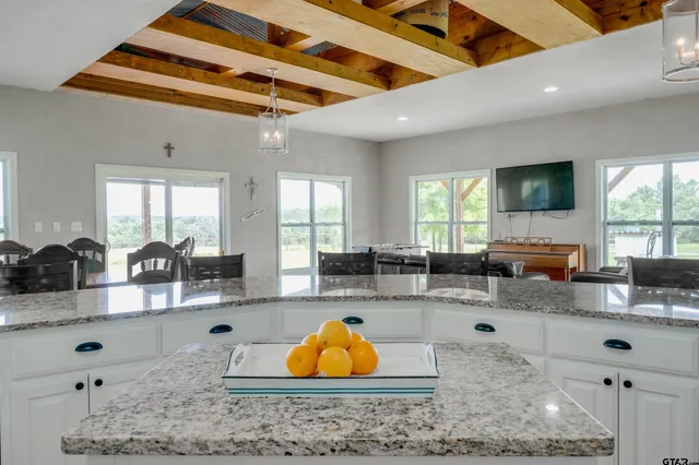 a kitchen with counter top space cabinets and appliances