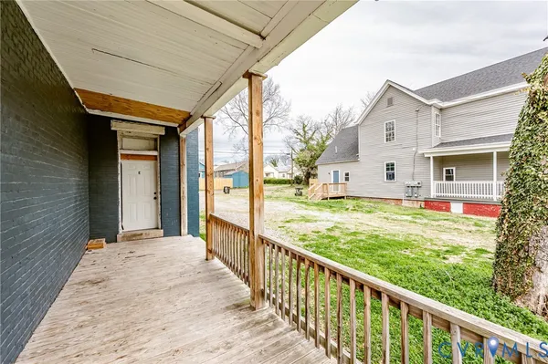 a view of a house with a sink and wooden floor