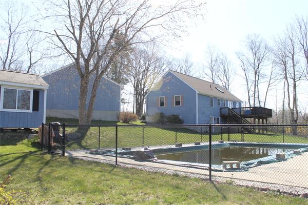 159 Northwest Road Spencer, MA 01562 - Photo 18 of 21 a view of a house with a backyard and a tree
