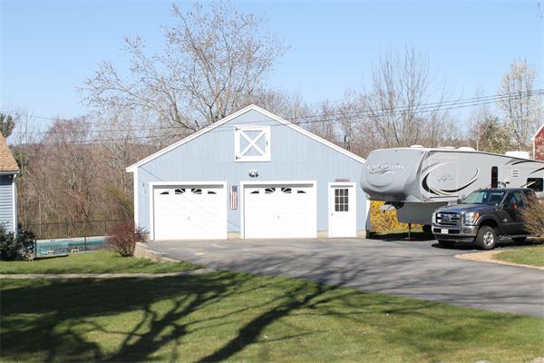 159 Northwest Road Spencer, MA 01562 - Photo 20 of 21 a front view of a house with garden