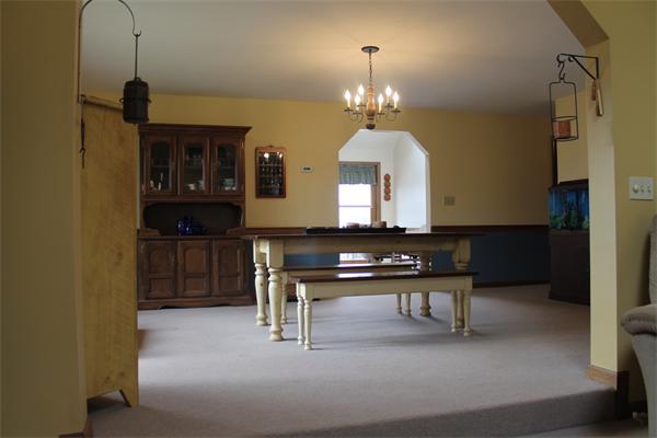 159 Northwest Road Spencer, MA 01562 - Photo 6 of 21 a view of hall way with furniture and chandelier