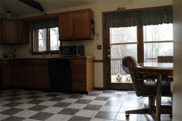 159 Northwest Road Spencer, MA 01562 - Photo 8 of 21 a kitchen with a sink a window and stainless steel appliances