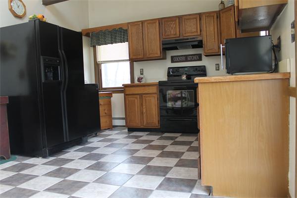 159 Northwest Road Spencer, MA 01562 - Photo 9 of 21 a kitchen with a refrigerator sink and microwave
