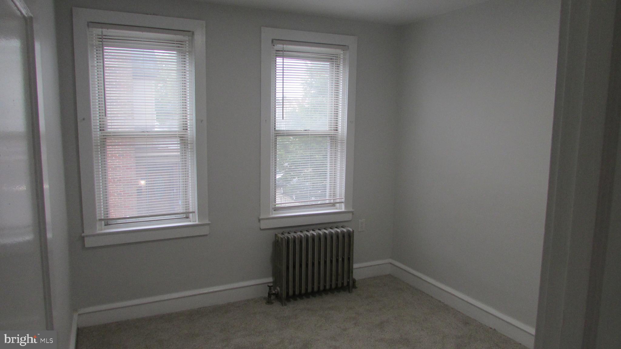 5324 Horrocks Street Philadelphia, PA 19124 - Photo 13 of 25 an empty room with windows