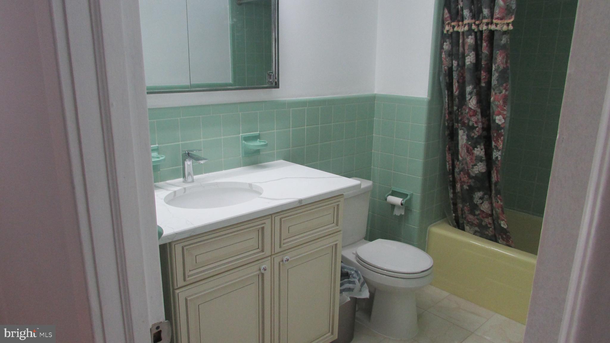 5324 Horrocks Street Philadelphia, PA 19124 - Photo 17 of 25 a bathroom with a sink a toilet and shower
