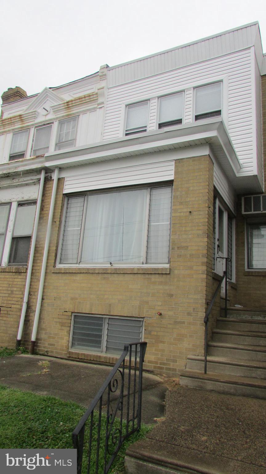 5324 Horrocks Street Philadelphia, PA 19124 - Photo 2 of 25 a front view of a house with many windows
