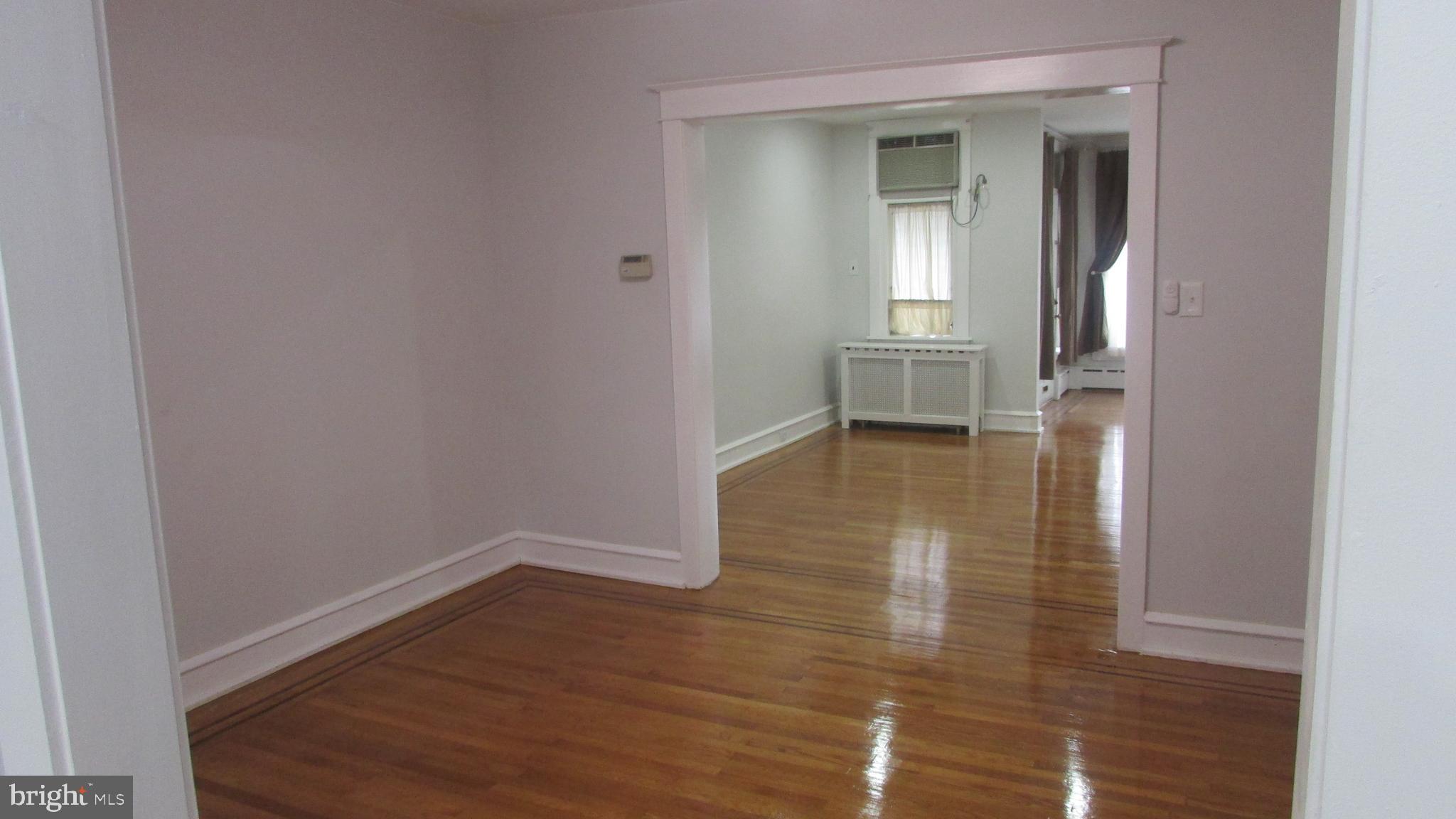 5324 Horrocks Street Philadelphia, PA 19124 - Photo 6 of 25 a view of empty room with wooden floor and fan