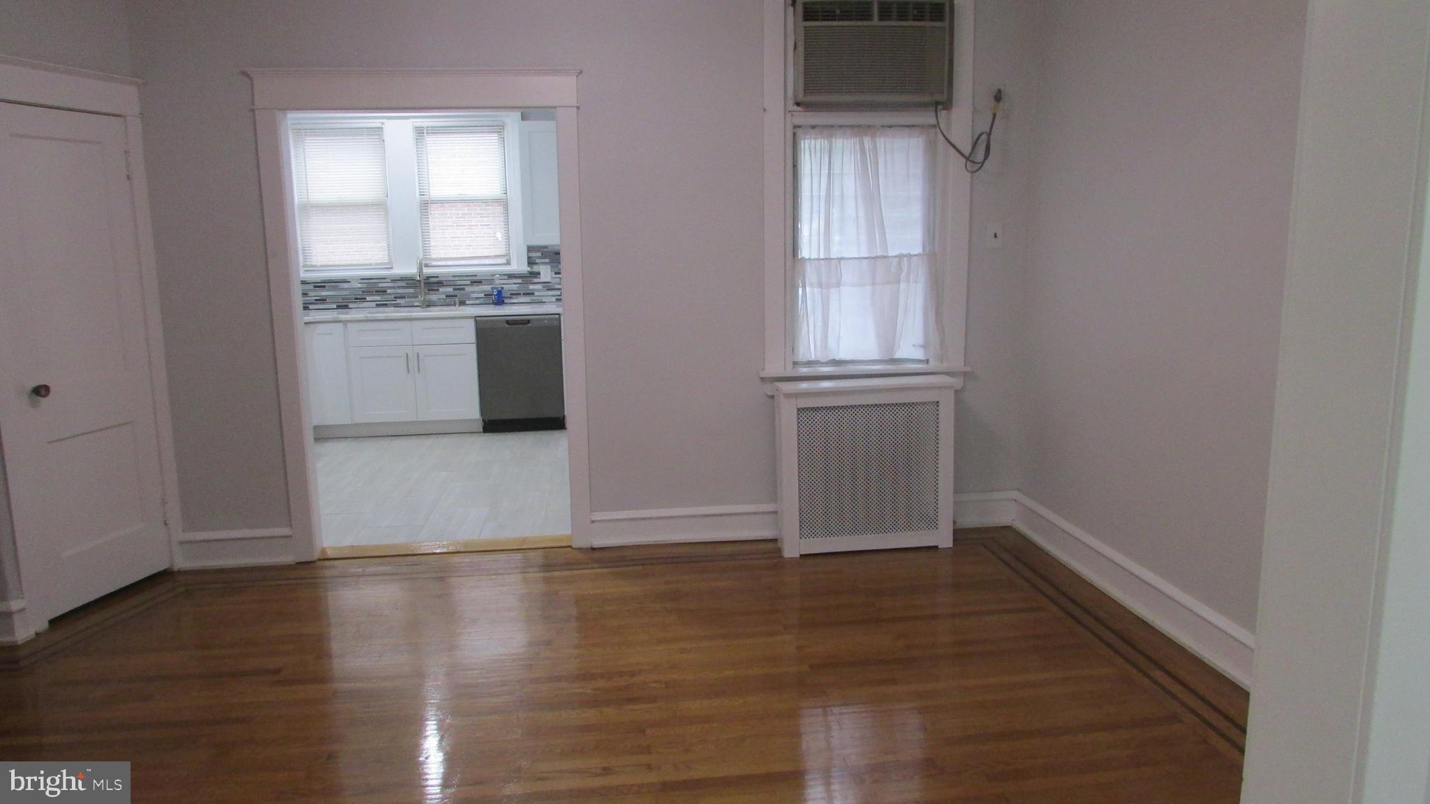 5324 Horrocks Street Philadelphia, PA 19124 - Photo 7 of 25 a view of a kitchen with wooden floor and a window
