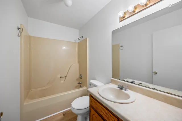 a bathroom with a sink toilet tub and shower