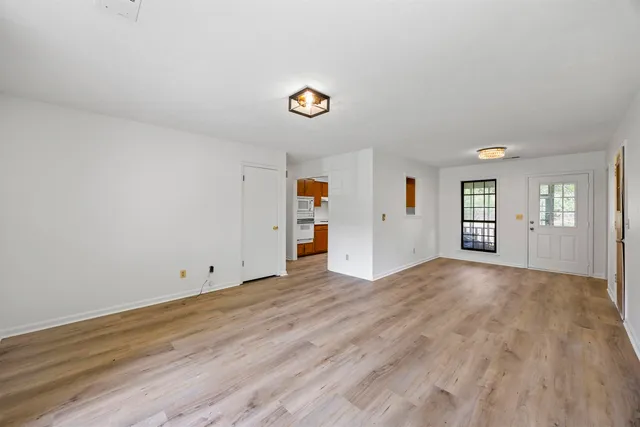 a view of an empty room with a window