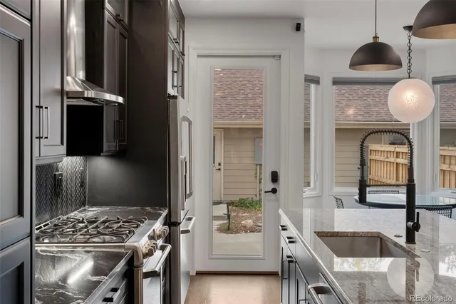 a kitchen with a sink and refrigerator