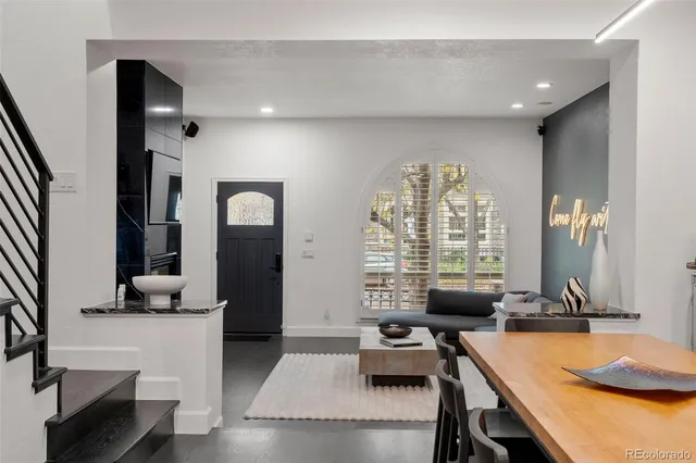 a dining room with table and chairs