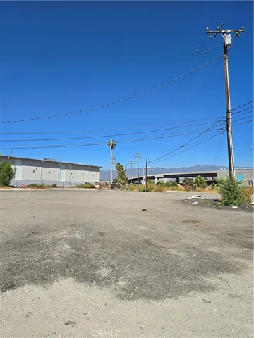 a view of a field with an ocean