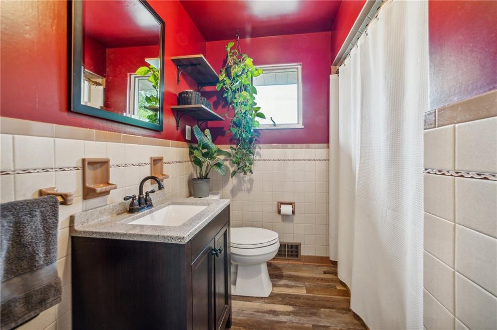 11401 McKee Road Irwin, PA 15642 - Photo 11 of 27 a bathroom with a sink toilet vanity and tub