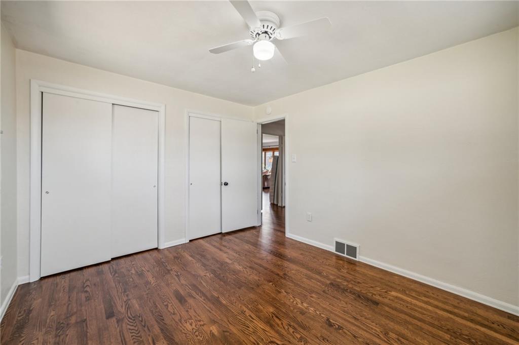 11401 McKee Road Irwin, PA 15642 - Photo 13 of 27 a view of an empty room with wooden floor