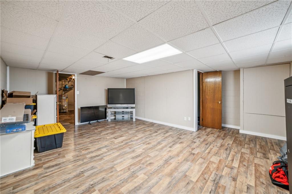 11401 McKee Road Irwin, PA 15642 - Photo 15 of 27 a view of a bedroom with furniture and wooden floor