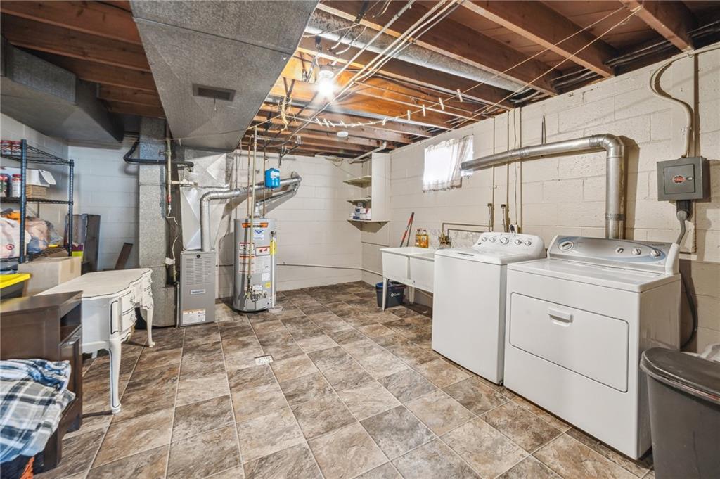 11401 McKee Road Irwin, PA 15642 - Photo 18 of 27 a utility room with cabinets